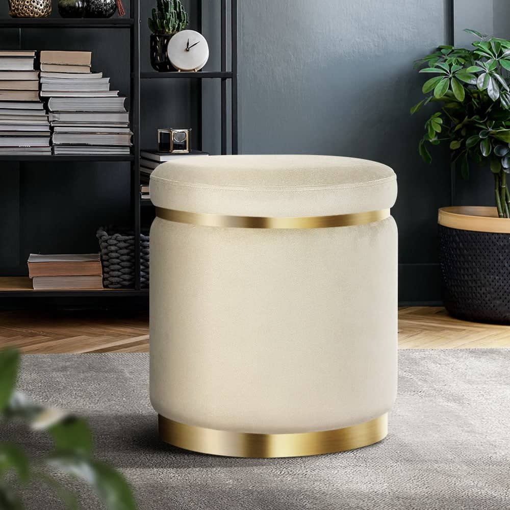 Round pouf with gold base belt